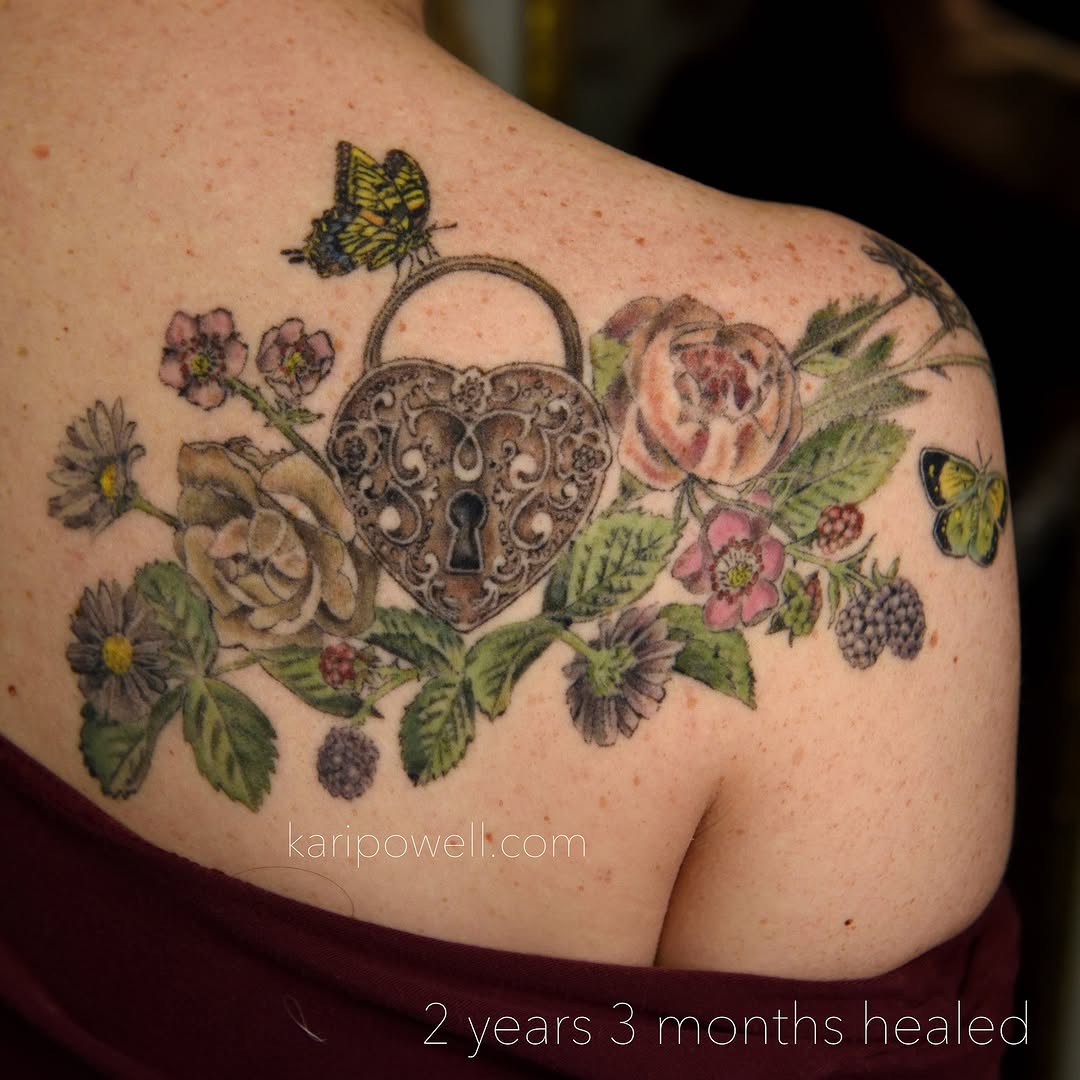 Intricate heart-lock centerpiece with blooming floral garland