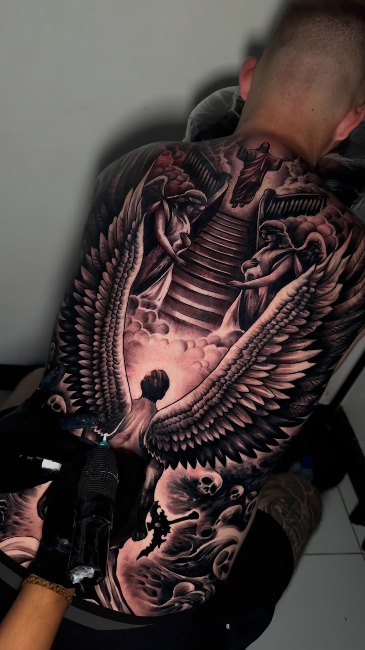 Grand black-and-gray angel wings with stairway to heaven