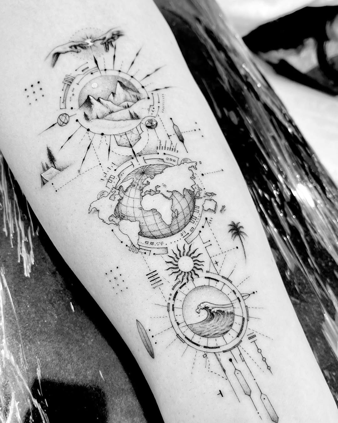 Geometric compass with globe, mountains and waves.