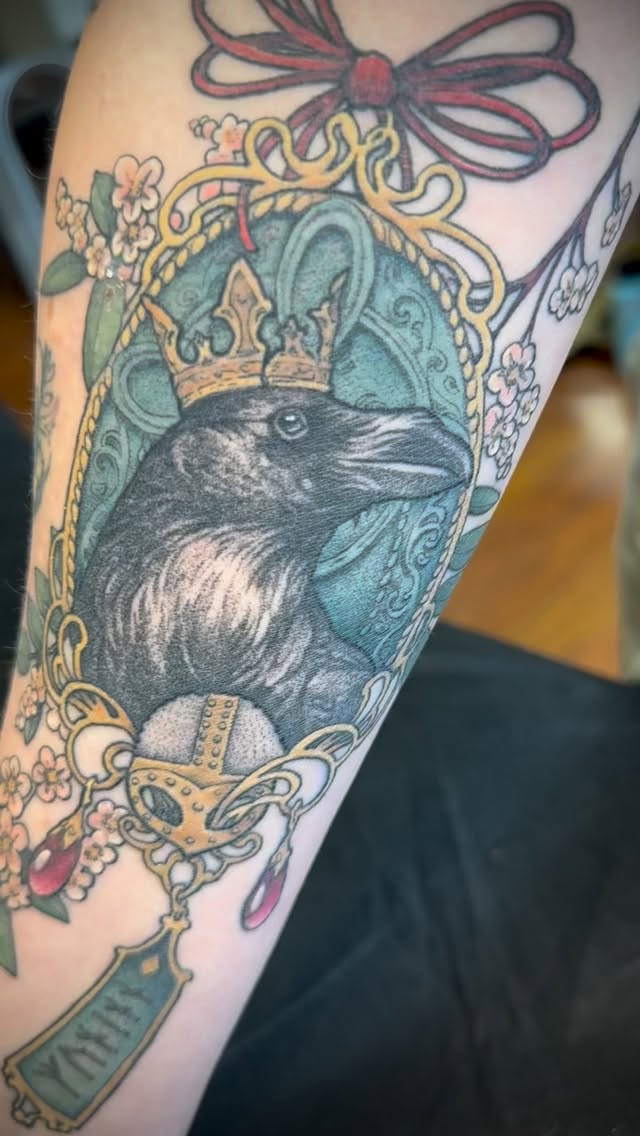 Regal crow portrait in ornate frame with florals