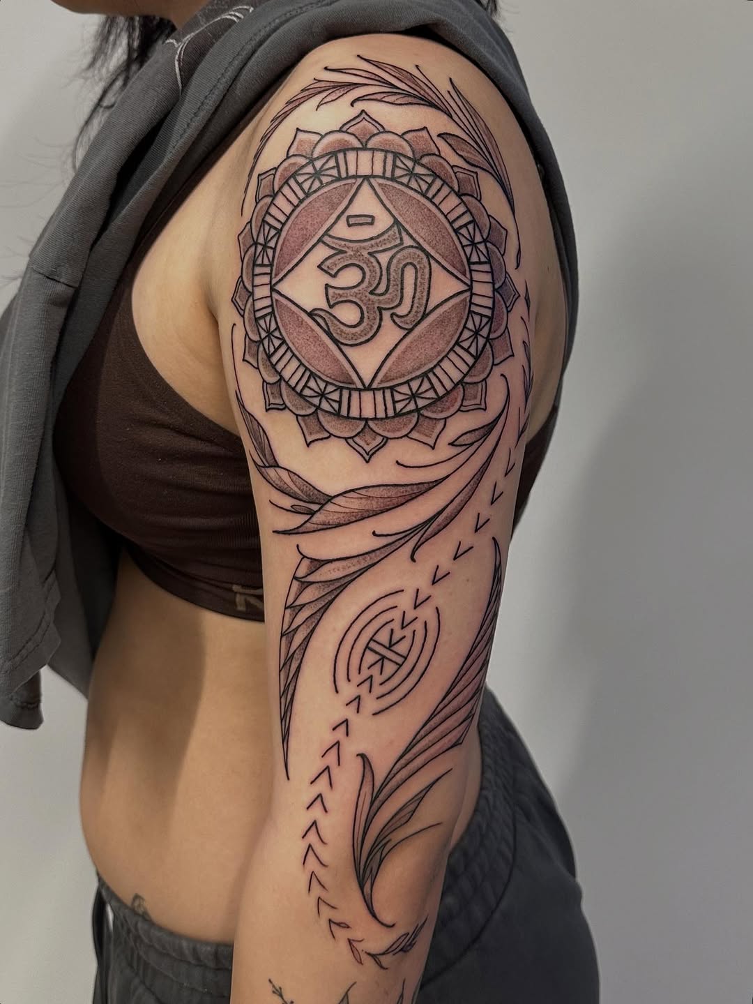 Intricate geometric mandala with Om glyph and leaf accents