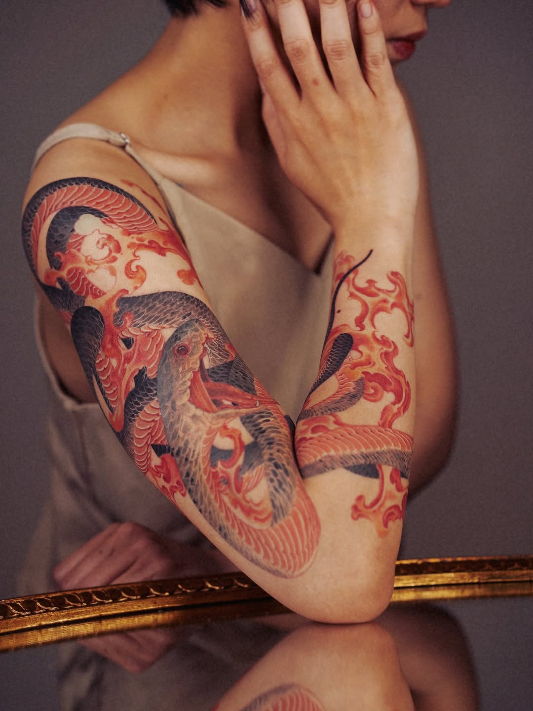 Vibrant Japanese-inspired serpent wrap with bold red flames