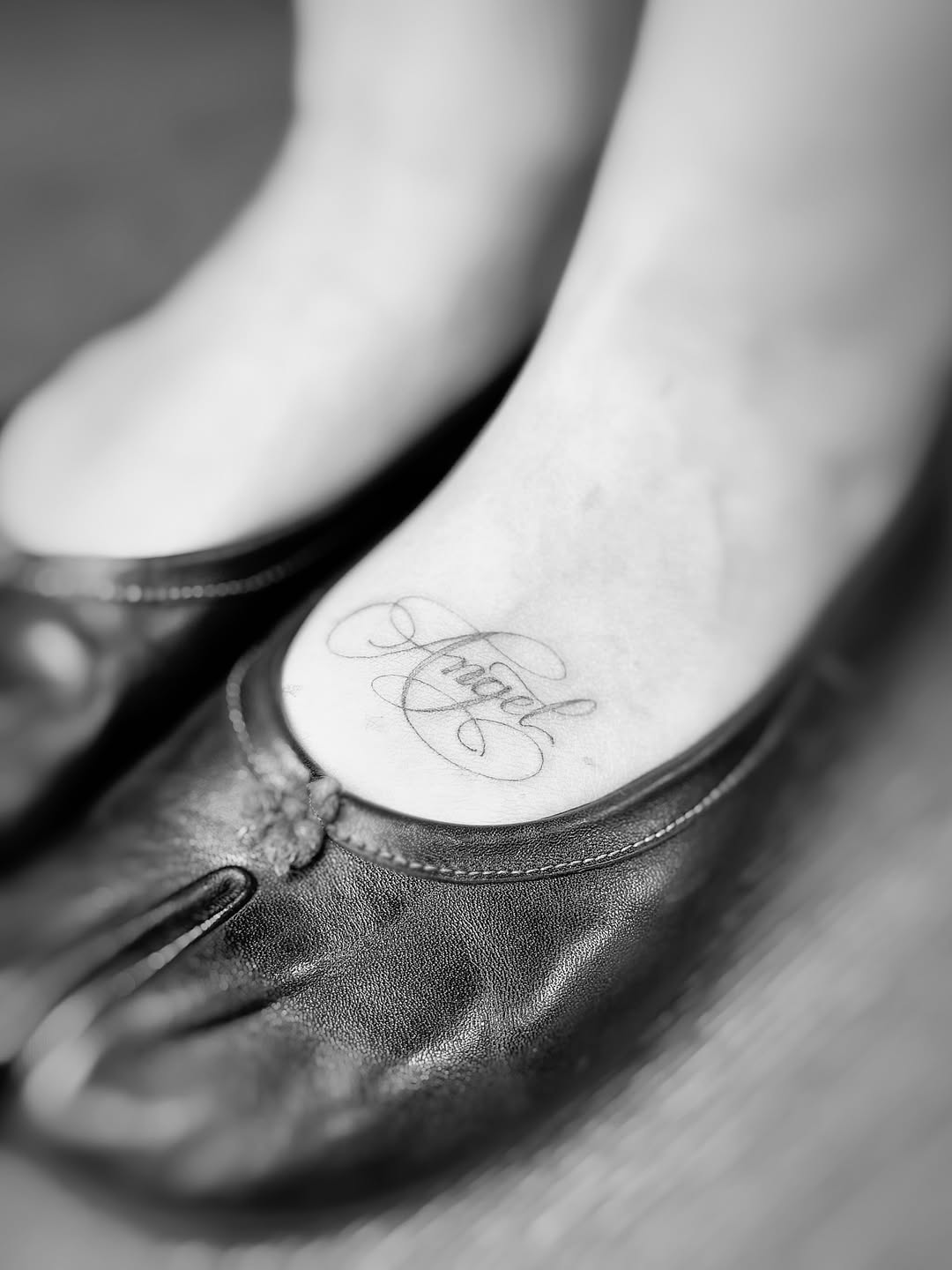 Delicate script word 'Love' with flowing swirls