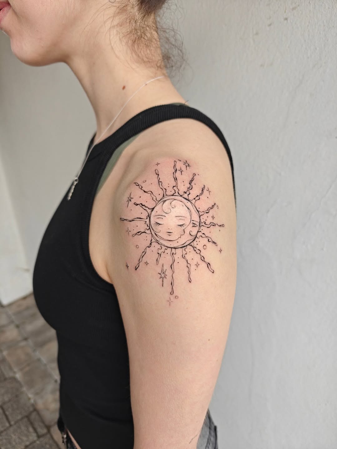 Delicate sun and moon celestial circle with radiant rays