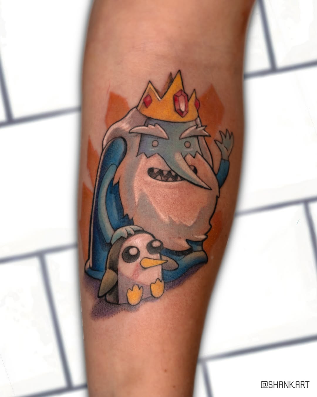 Bold cartoon Ice King with playful penguin duo.