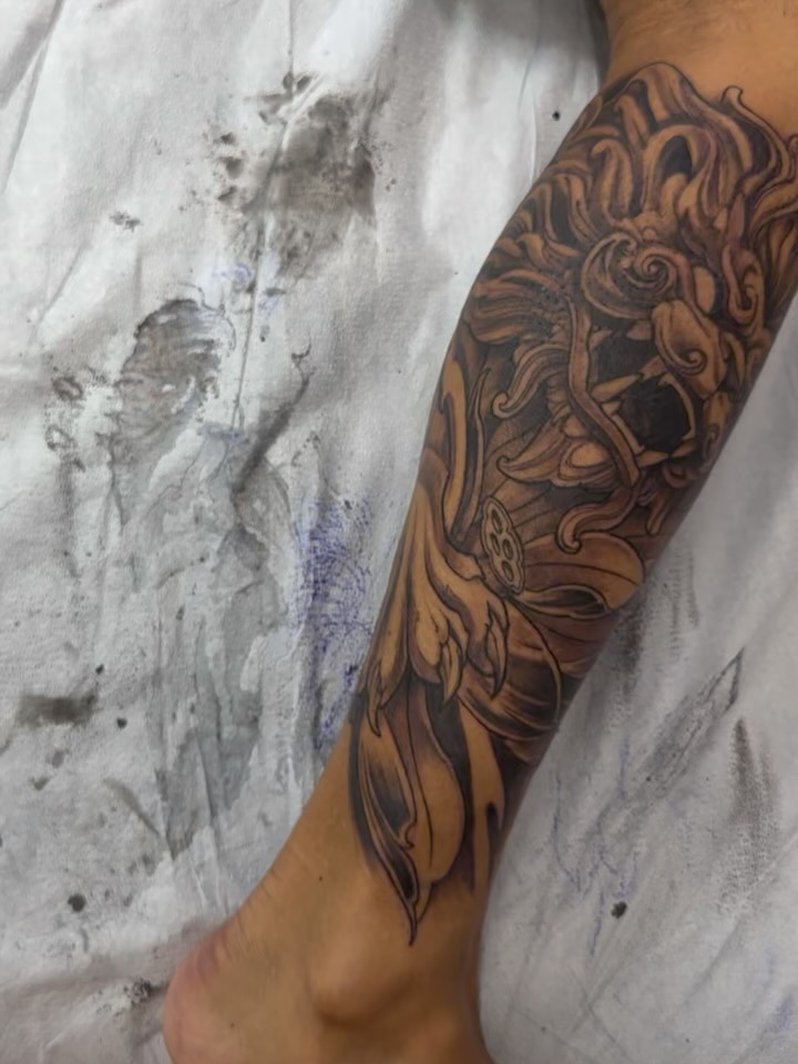 Intricate black-and-gray Japanese-inspired floral sleeve segment