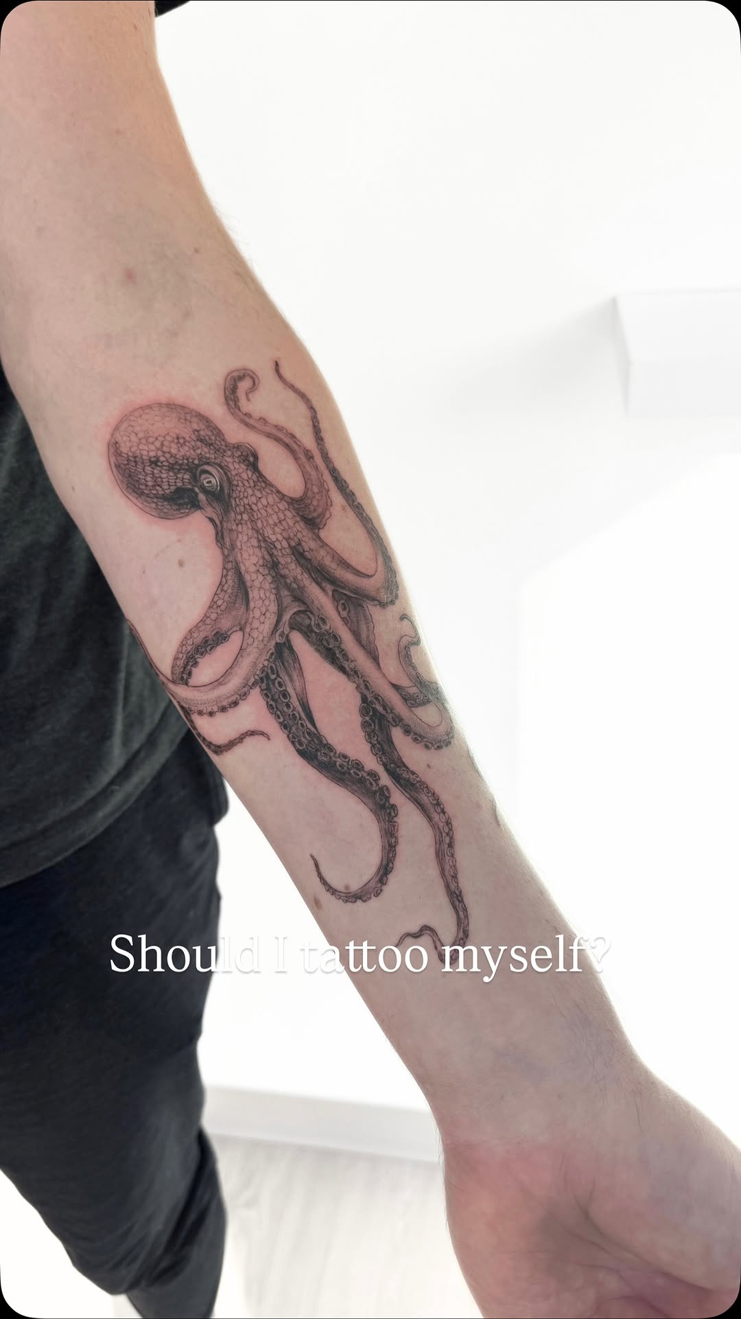 Intricate blackwork octopus with stippled shading and curling tentacles