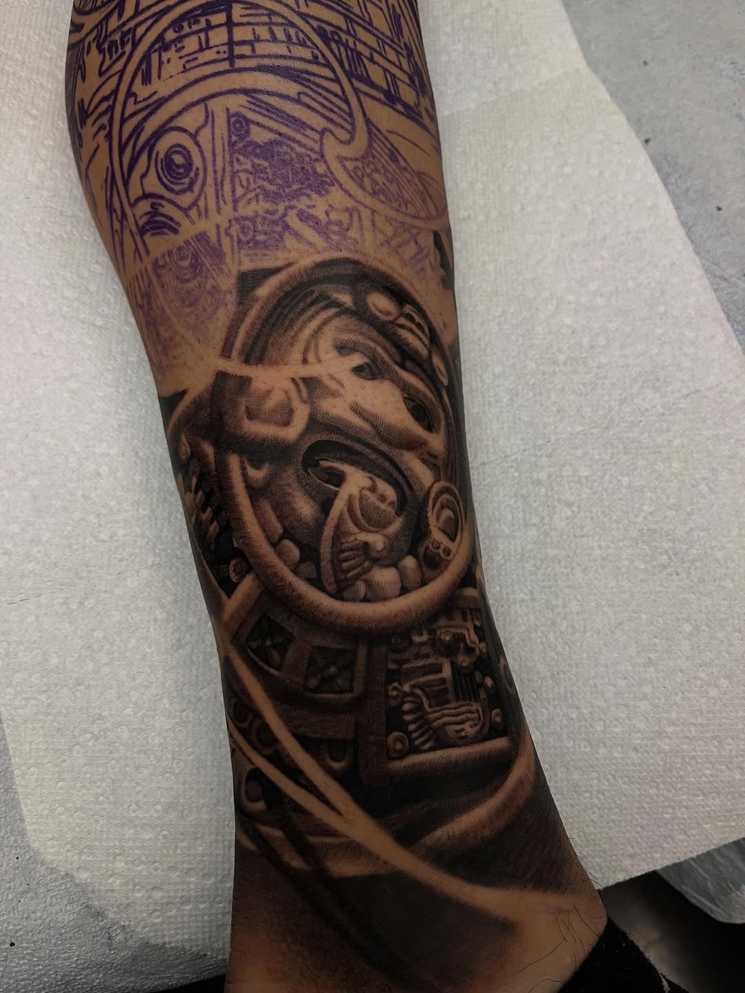 Hyper-detailed biomechanical leg sleeve with gears and shadows