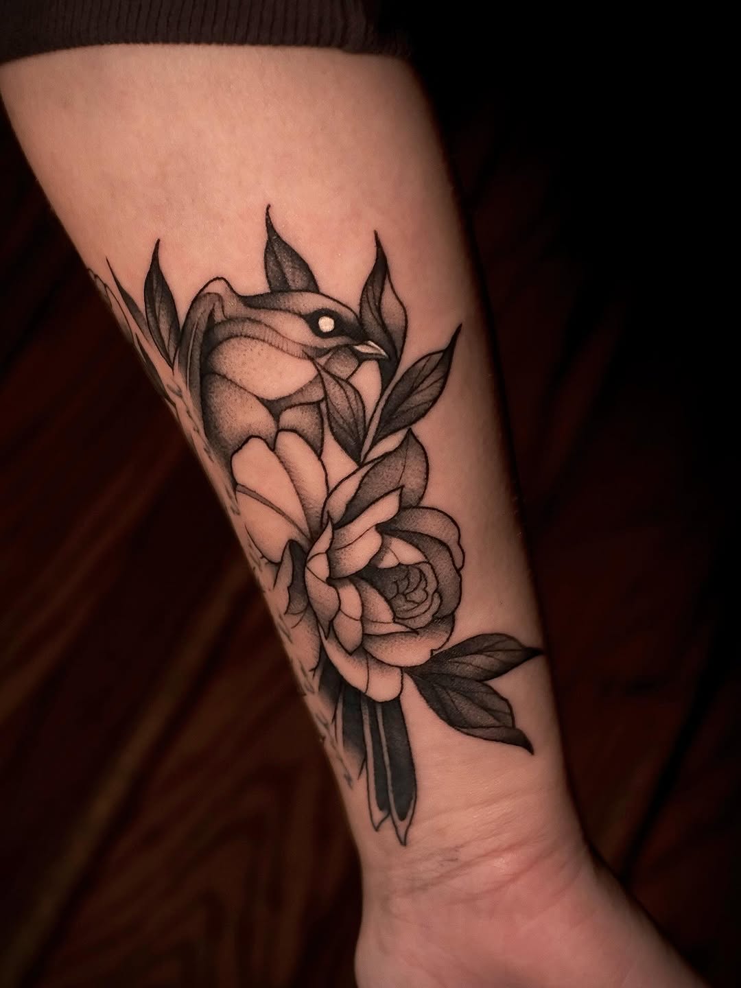 Bold blackwork hummingbird entwined with blooming rose