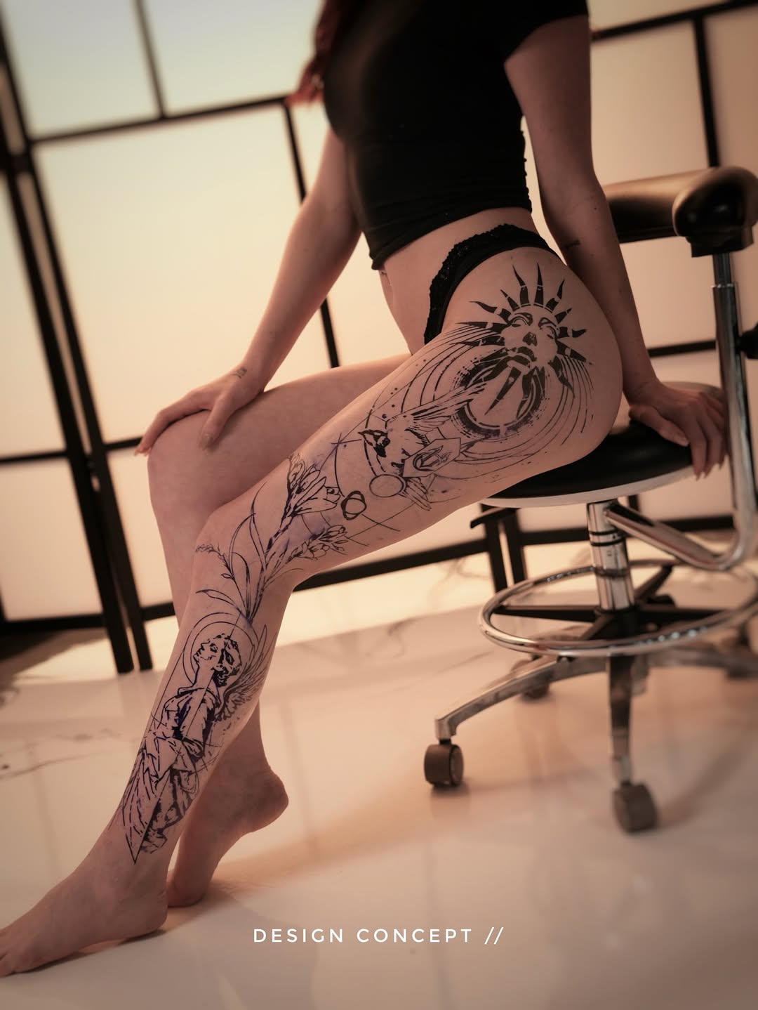 Bold black-line sunburst leg sleeve with floral vines