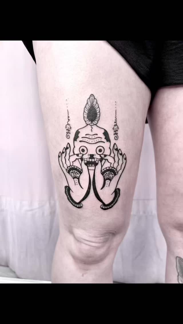 Bold blackwork mudra-hands with tibetan skull on leg