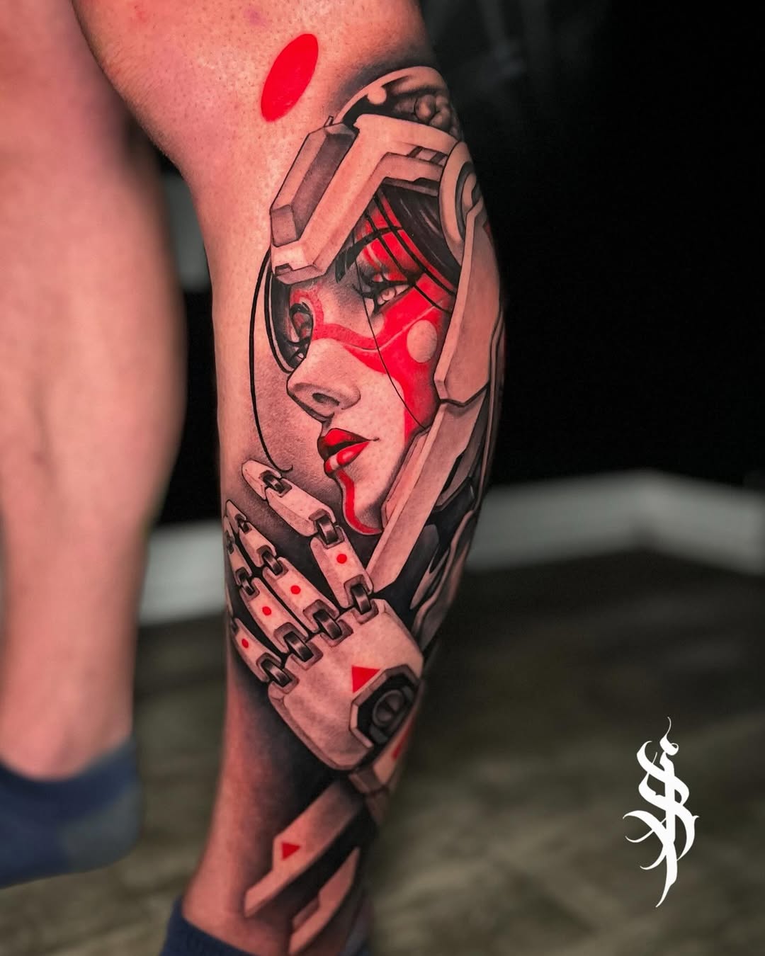 Striking cybernetic female portrait with red accents.