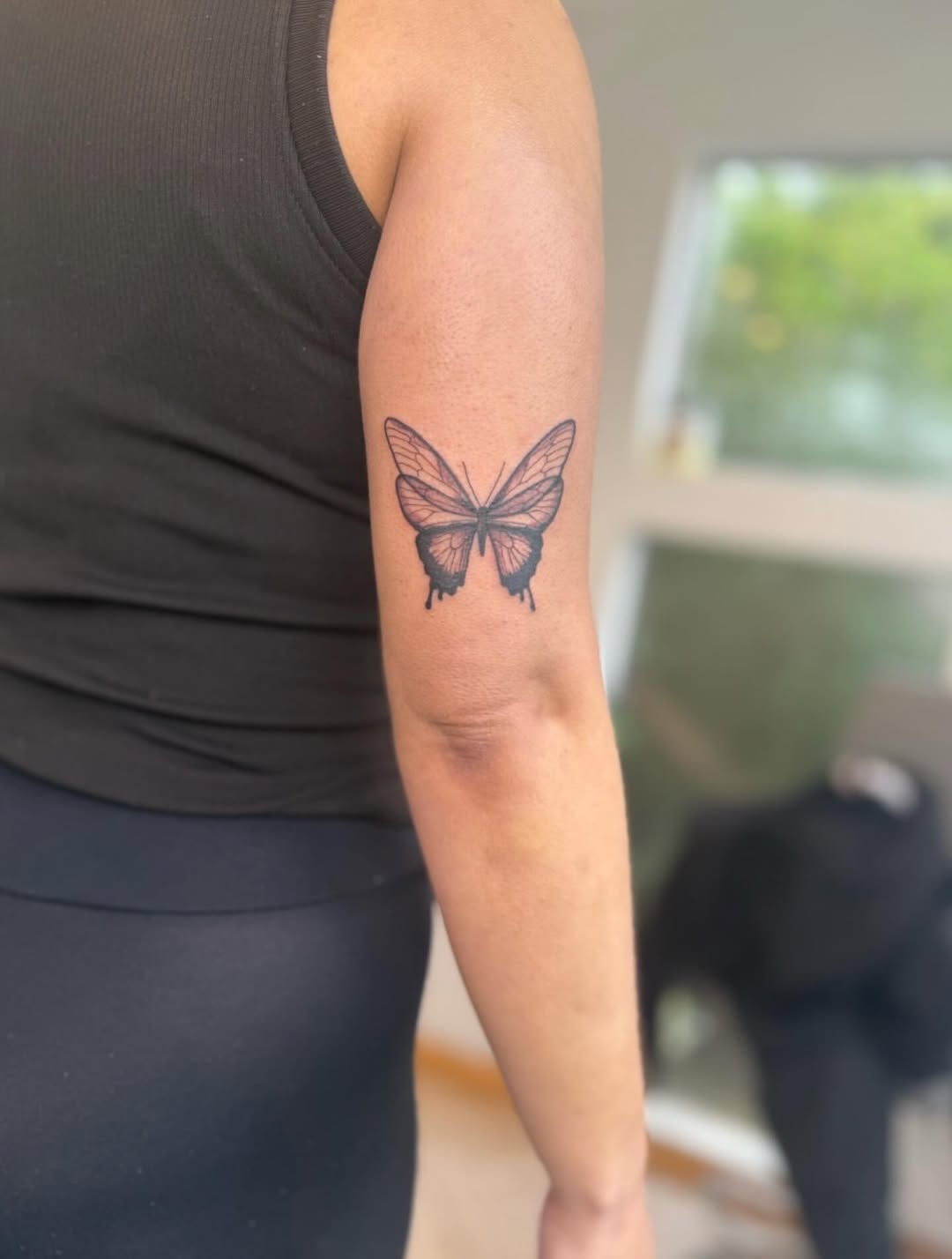 Delicate black butterfly with dripping ink accents