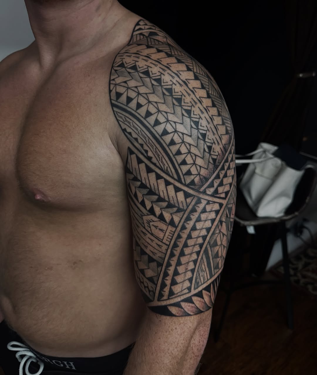 Bold Polynesian-inspired geometric shoulder sleeve with crisp lines