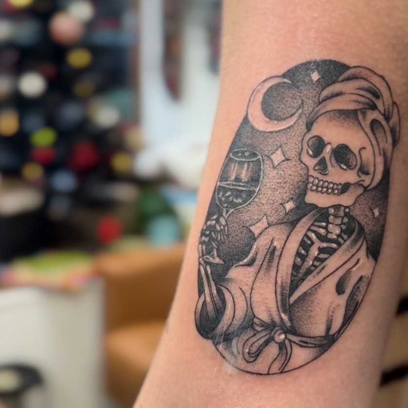 Stark blackwork skeleton in robe with wine glass, moonlit