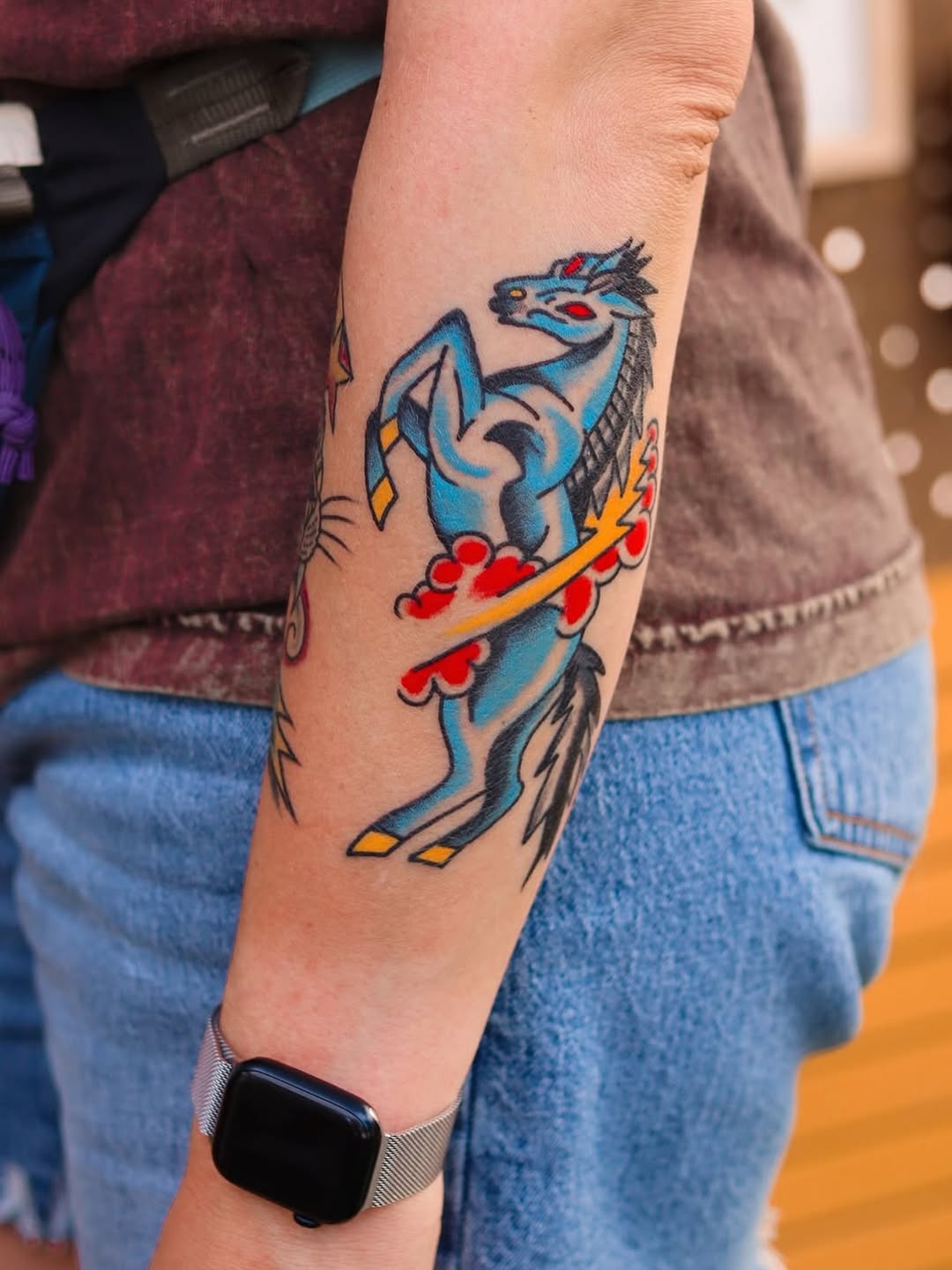 Bold blue dragon in cartoonish, neo-traditional style.