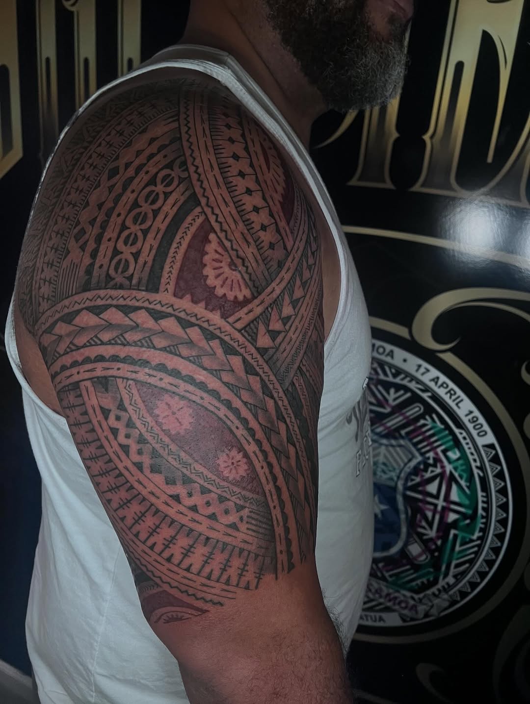 Intricate Polynesian blackwork shoulder-to-arm geometric sleeve