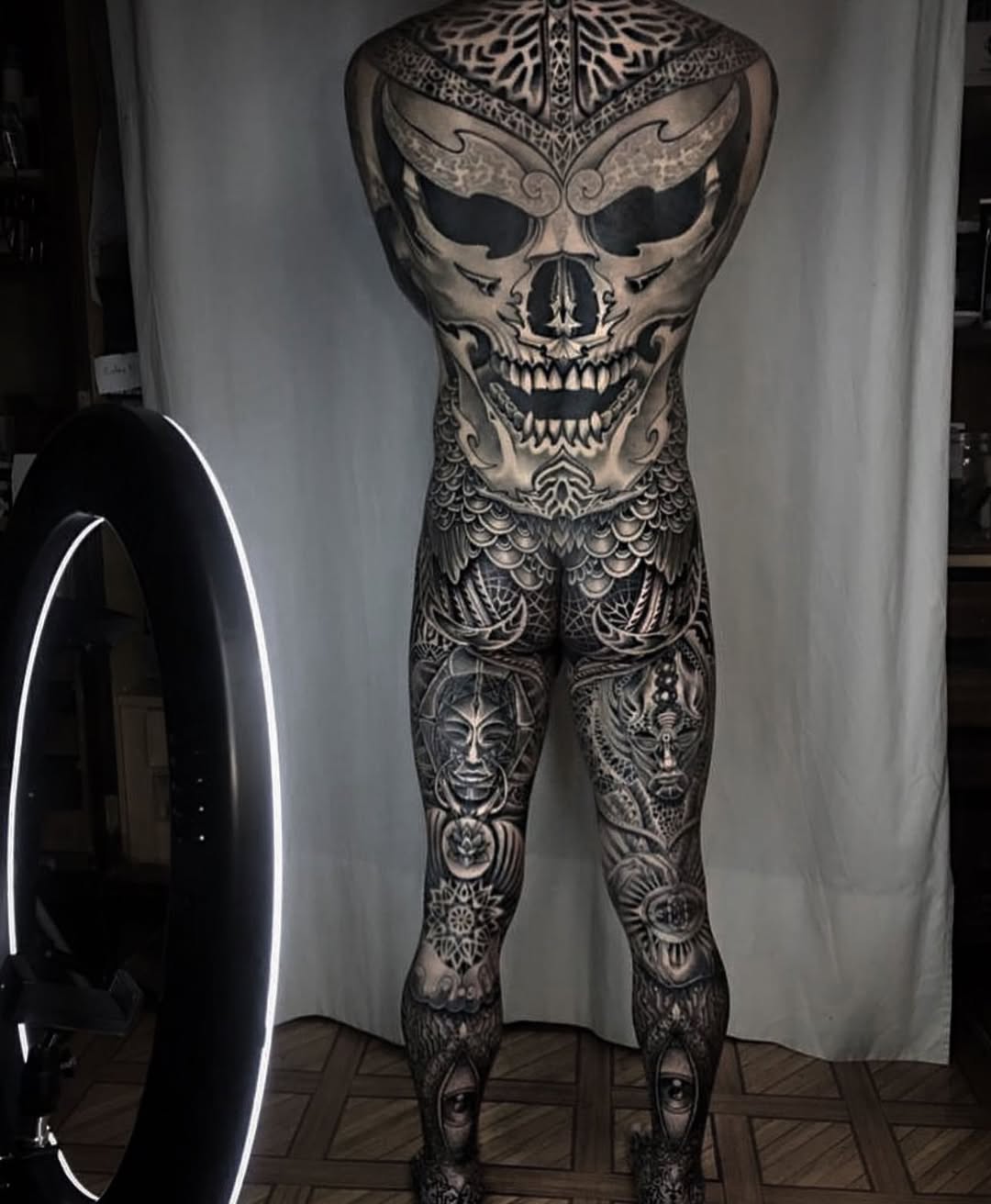 Monumental grayscale back piece with skull and ornate filigree