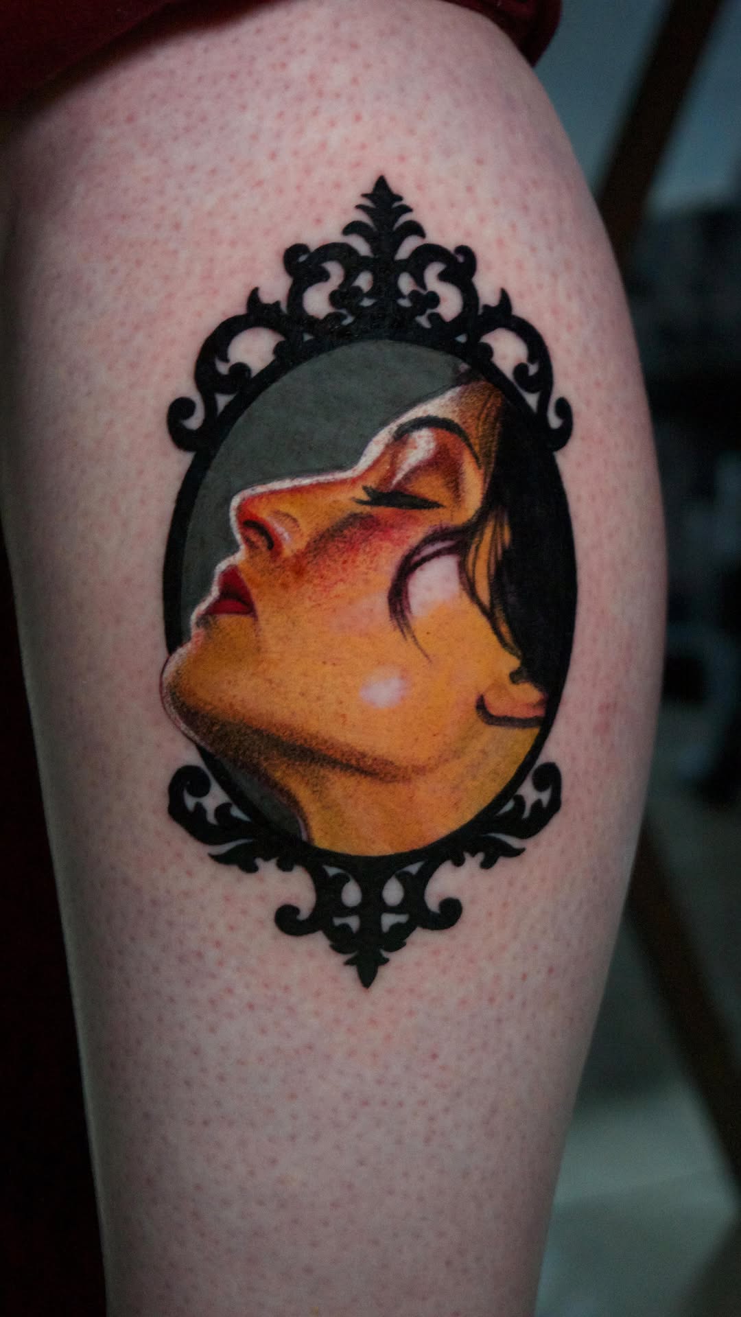 Vibrant female portrait within intricate black lace frame