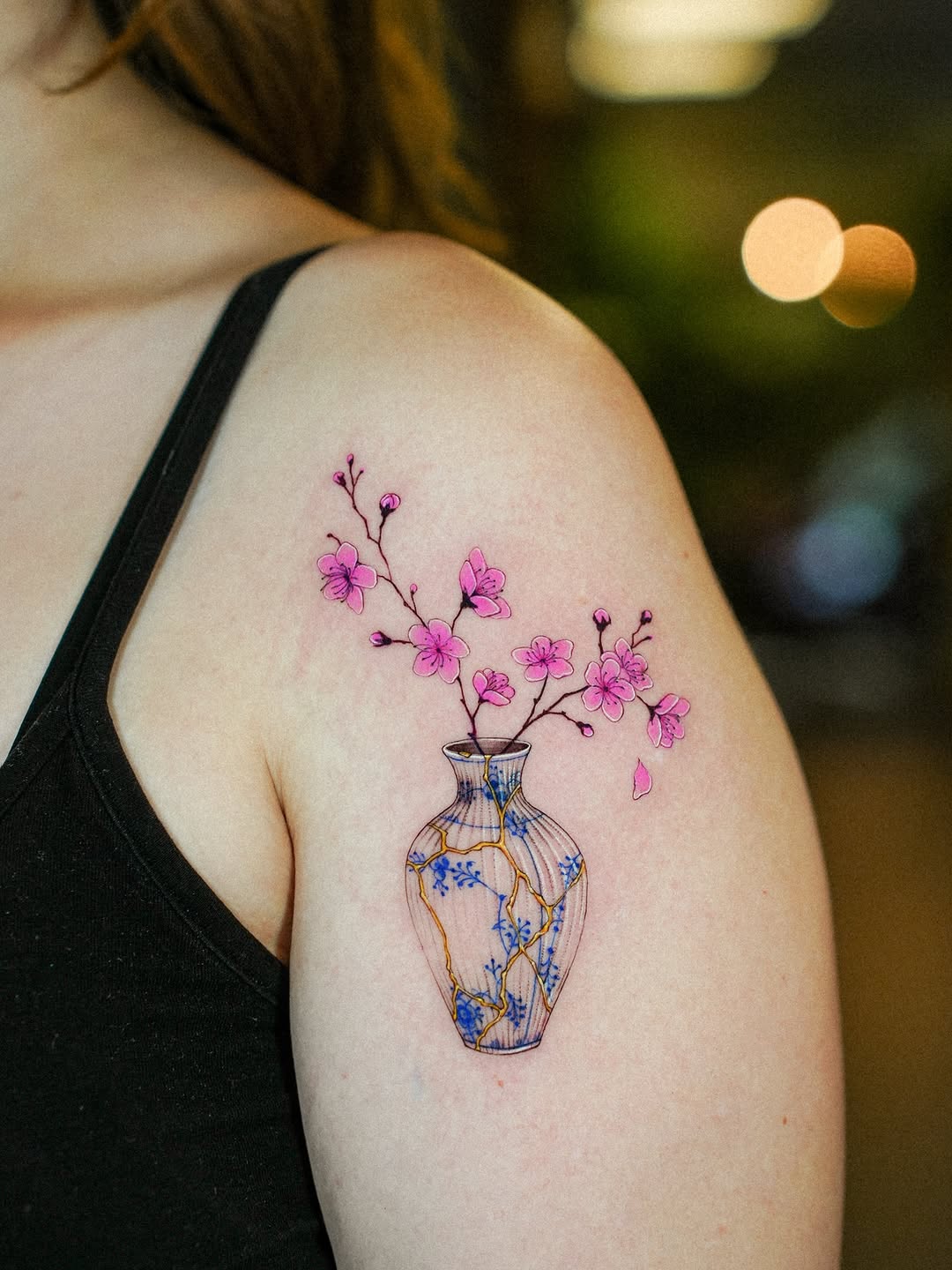 Kintsugi vase with delicate pink cherry blossoms