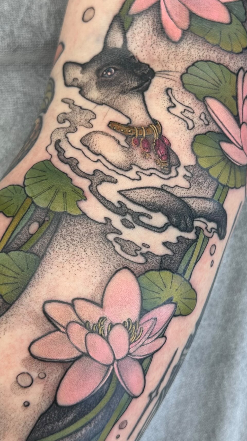 Whimsical dog-like mammal with jeweled collar among lotus