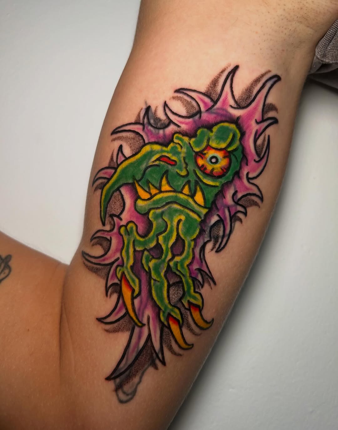Neon-green goblin monster with sharp teeth, cartoonish style