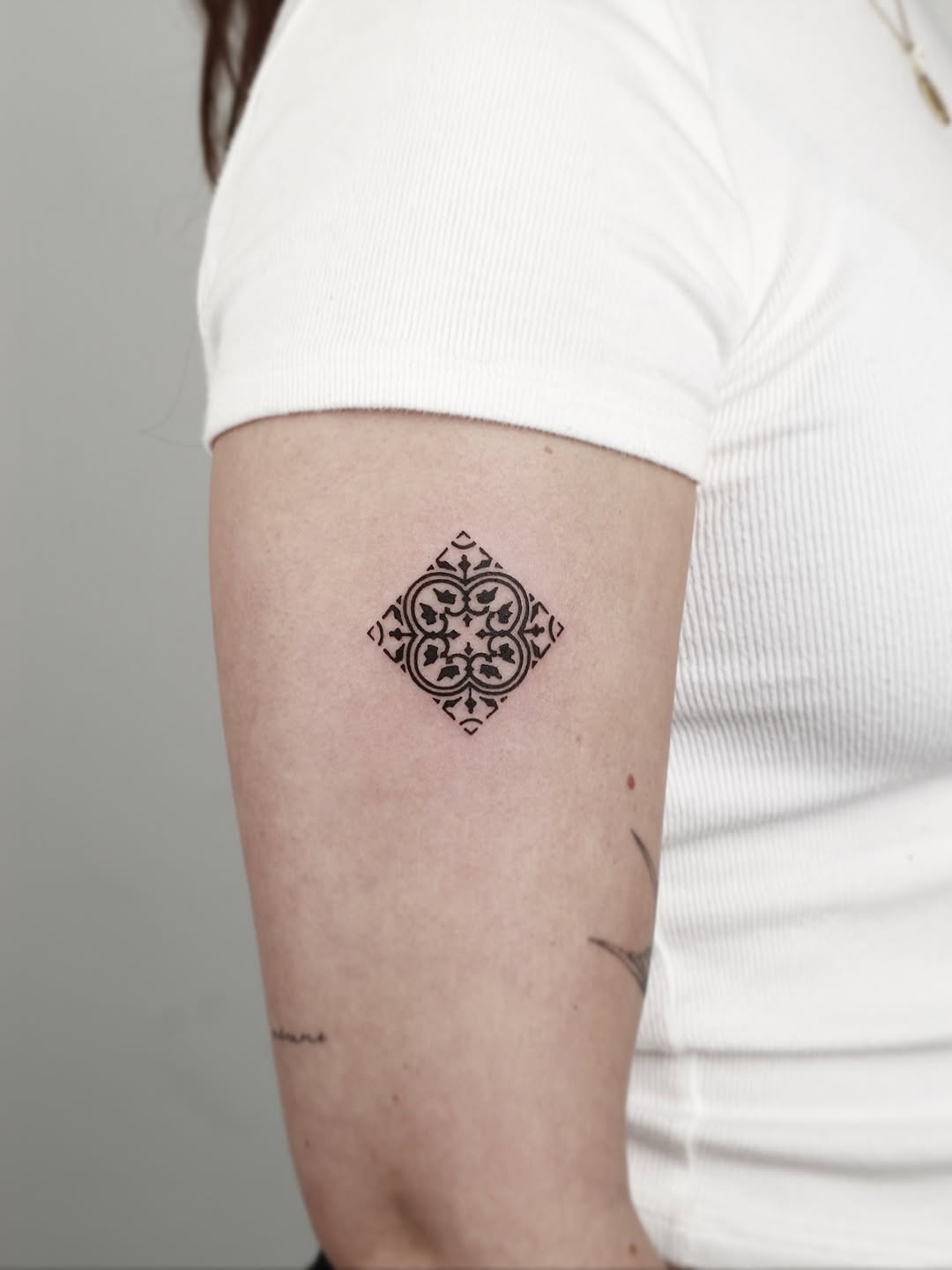 Intricate black ornamental diamond tattoo with filigree