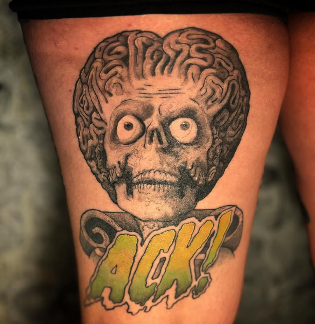 Grinning skull with exposed brain cap and neon 'AXE' banner