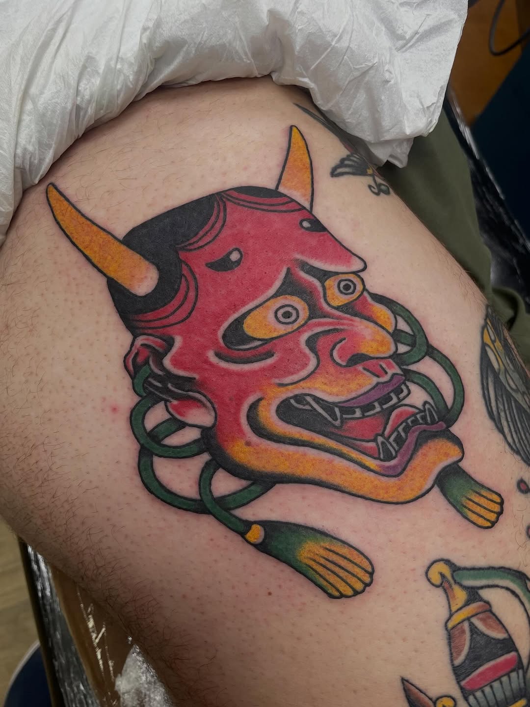 Vivid Japanese Hannya mask with bold outlines and color