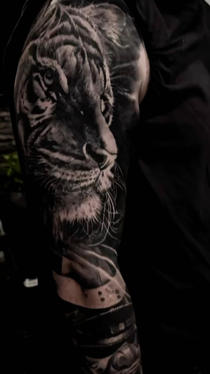 Hyper-detailed grayscale tiger head on a sleeve