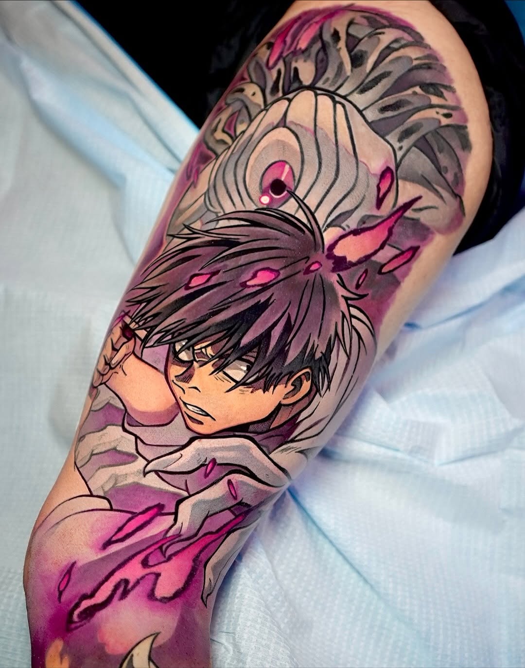 Vibrant anime-inspired forearm piece with bold linework and pink accents