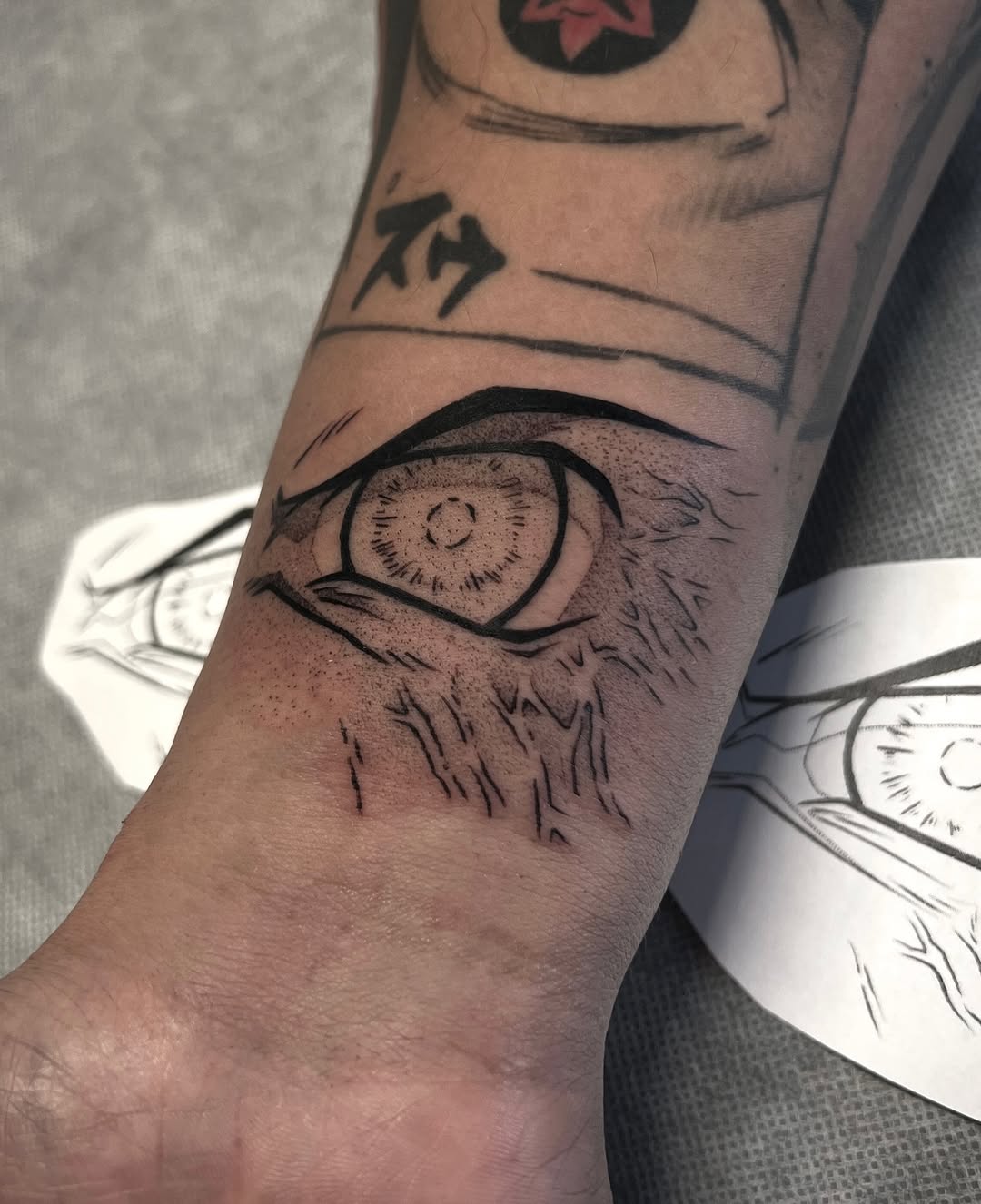 Bold Byakugan eye with rugged linework on forearm
