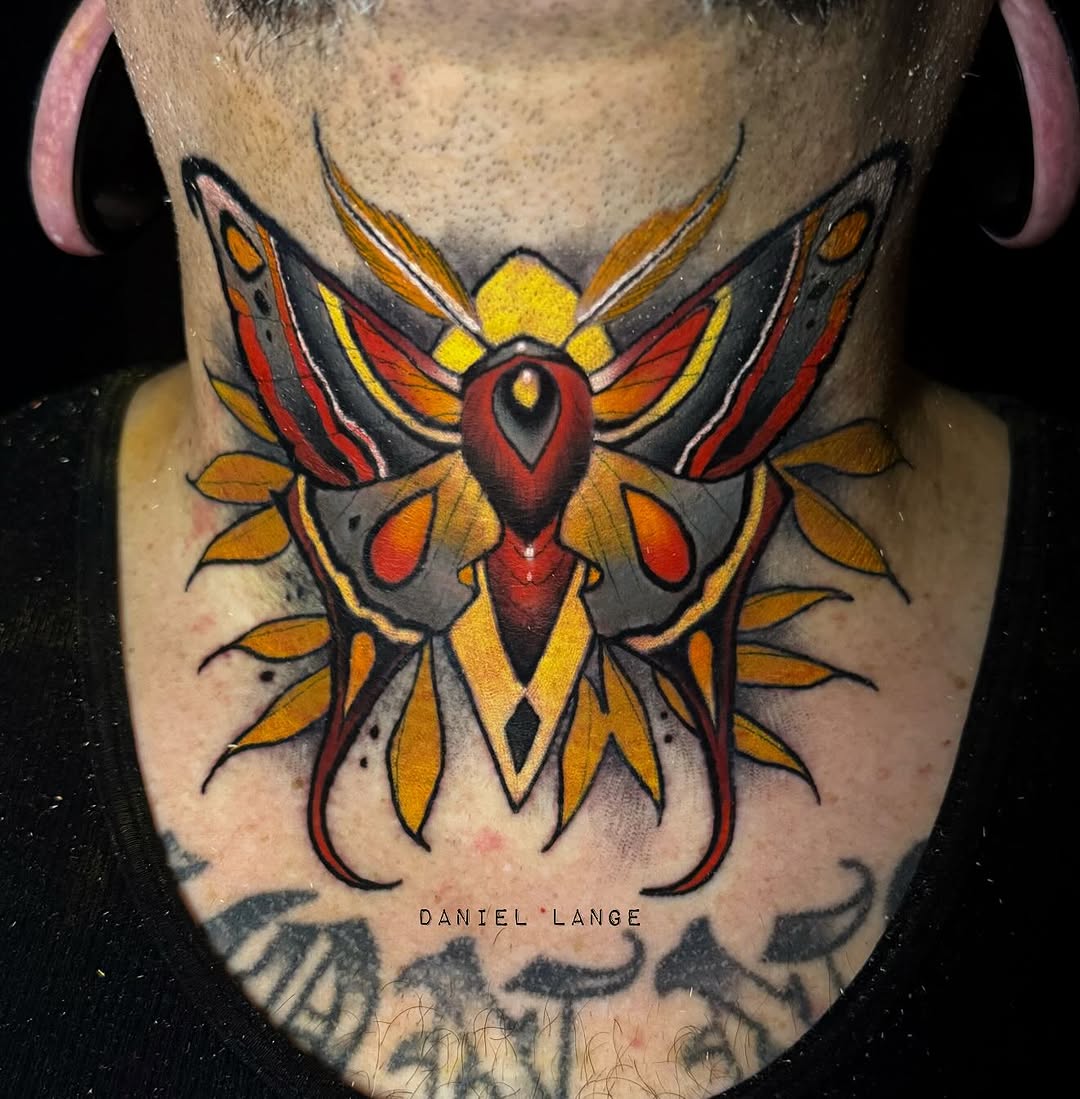 Colorful moth neck tattoo