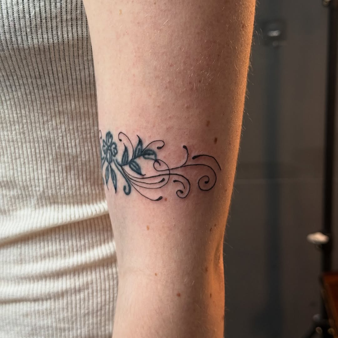 Delicate black floral filigree with curling swirls