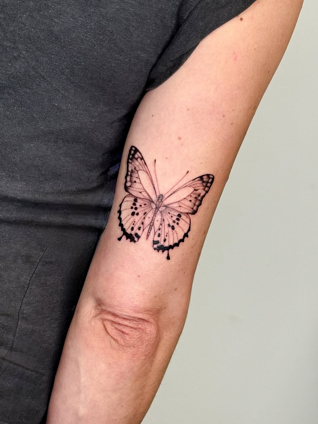 Butterfly tattoo on arm