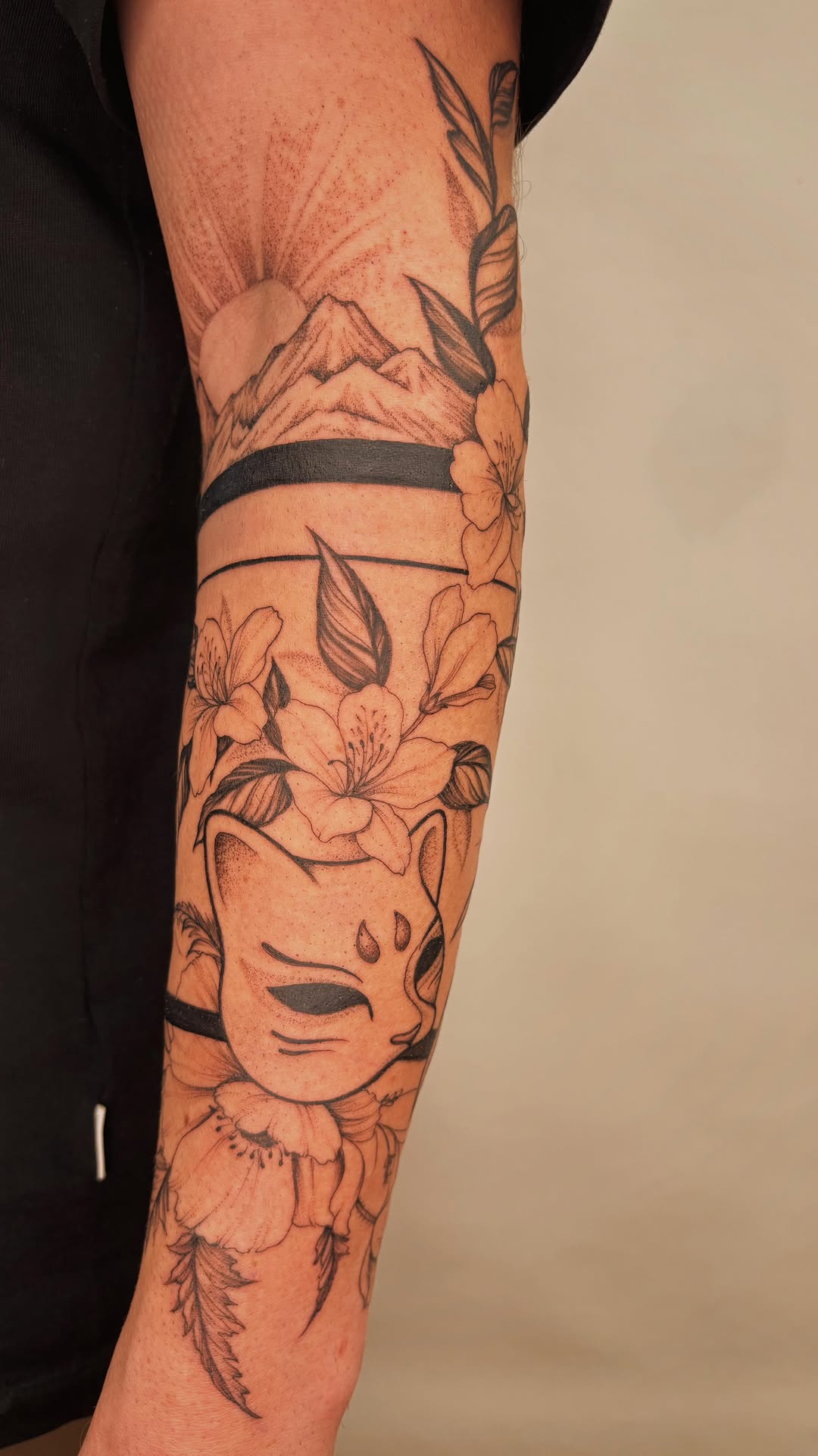 Freehand Japanese-inspired half-sleeve with kitsune mask and blossoms