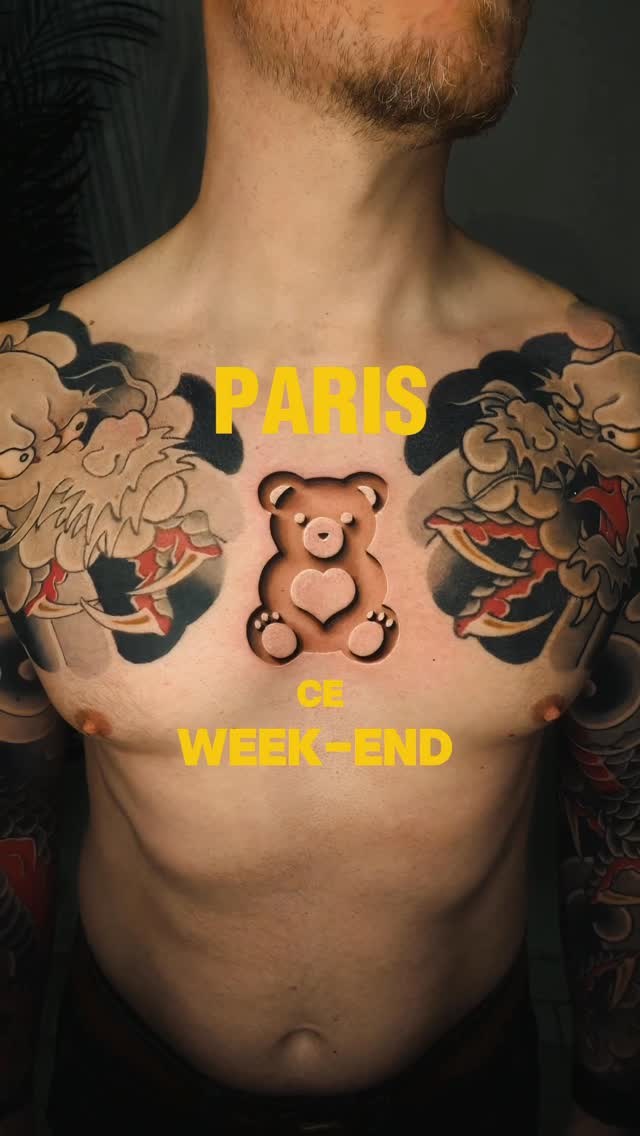 Bold chest tattoo with dual dragons and central teddy