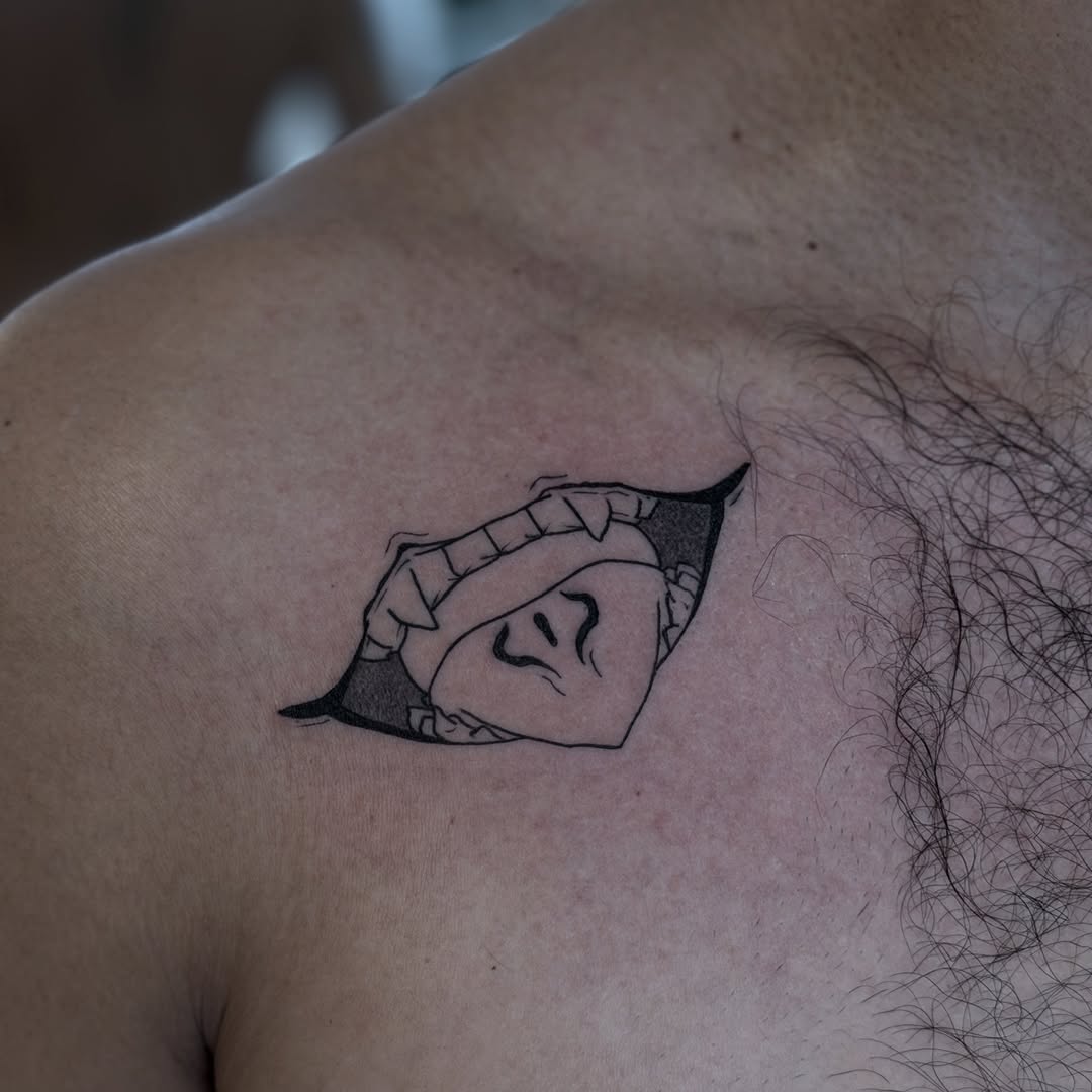Sukuna-inspired minimalist mask-mouth tattoo in bold lines