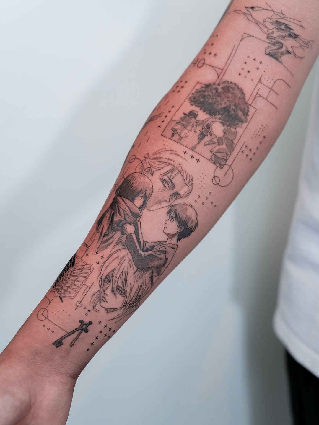 Manga-inspired Attack on Titan montage on forearm