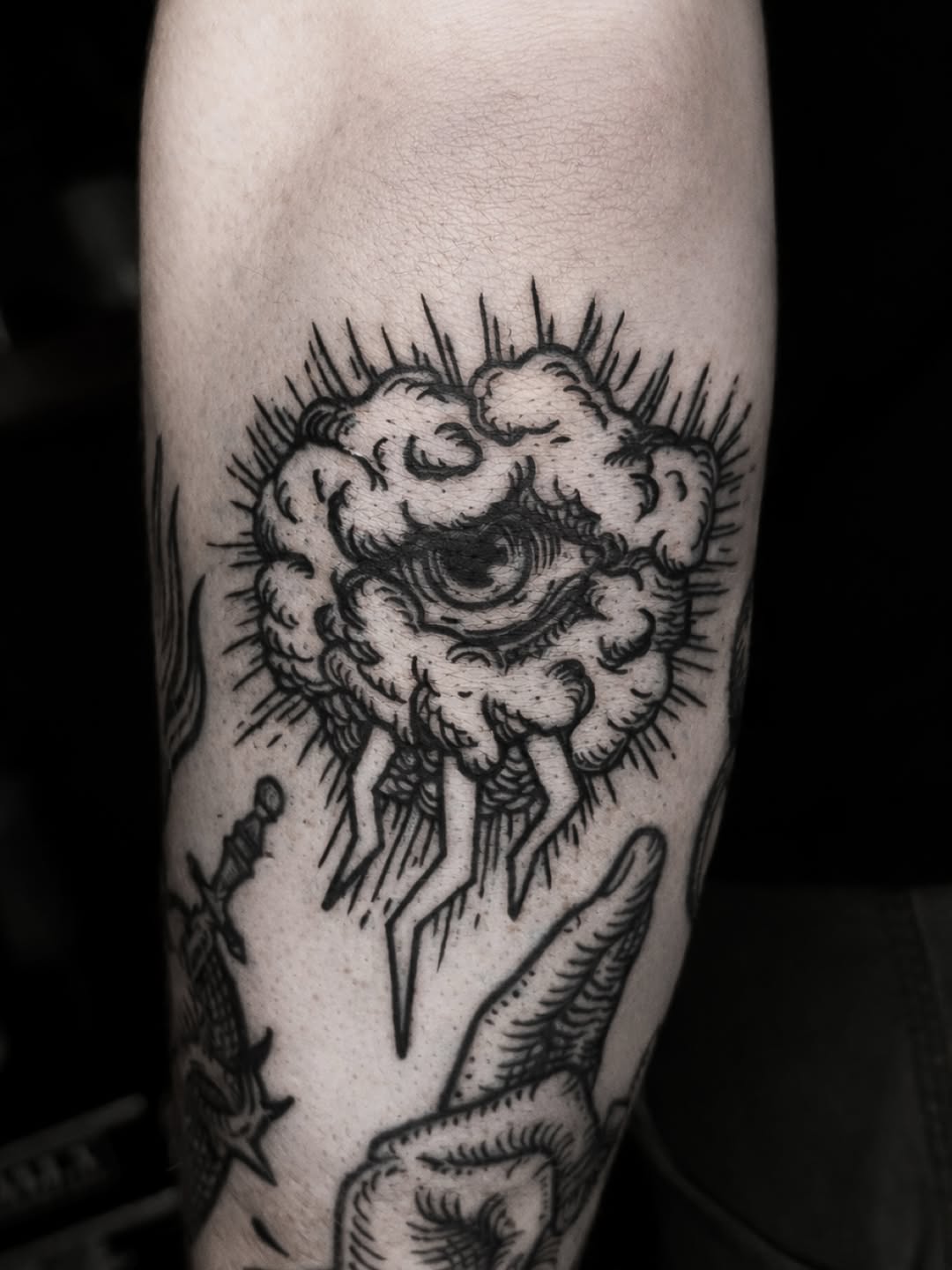 Piercing eye within a billowing cloud, bold woodcut lines.