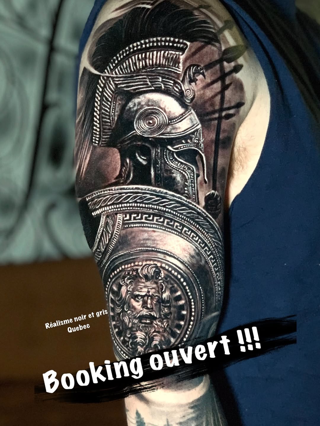 Hyper-detailed black-and-gray mythic helmet with ornate medallion