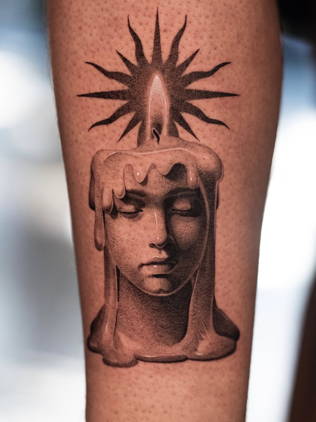 Melting, serene bust with radiant sunburst crown.