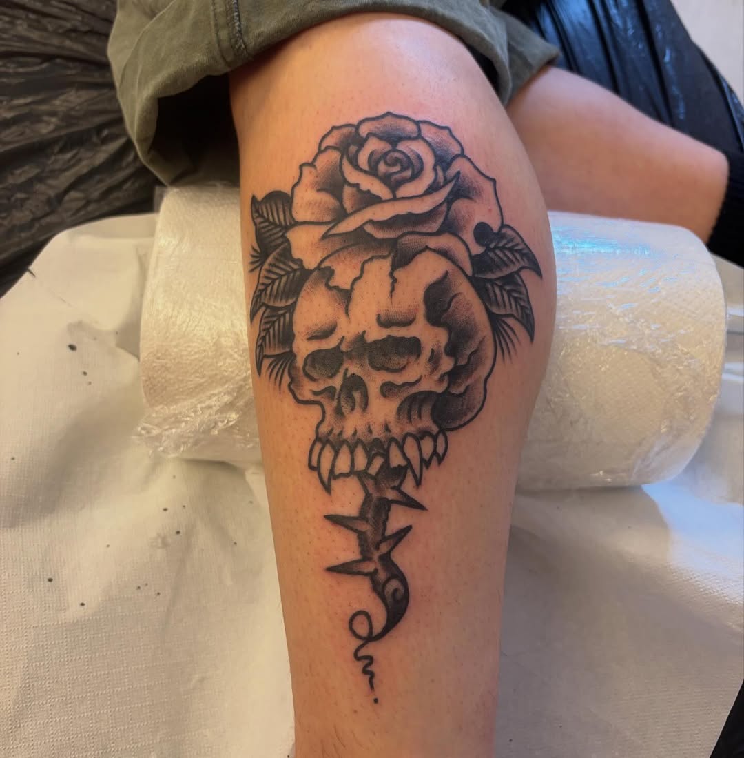 Bold skull with rose crown and thorned stem