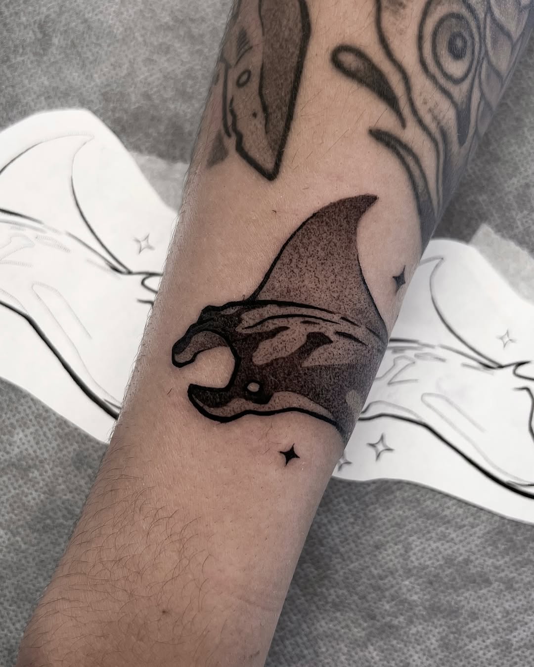 Bold black manta ray wrap with dotwork shading