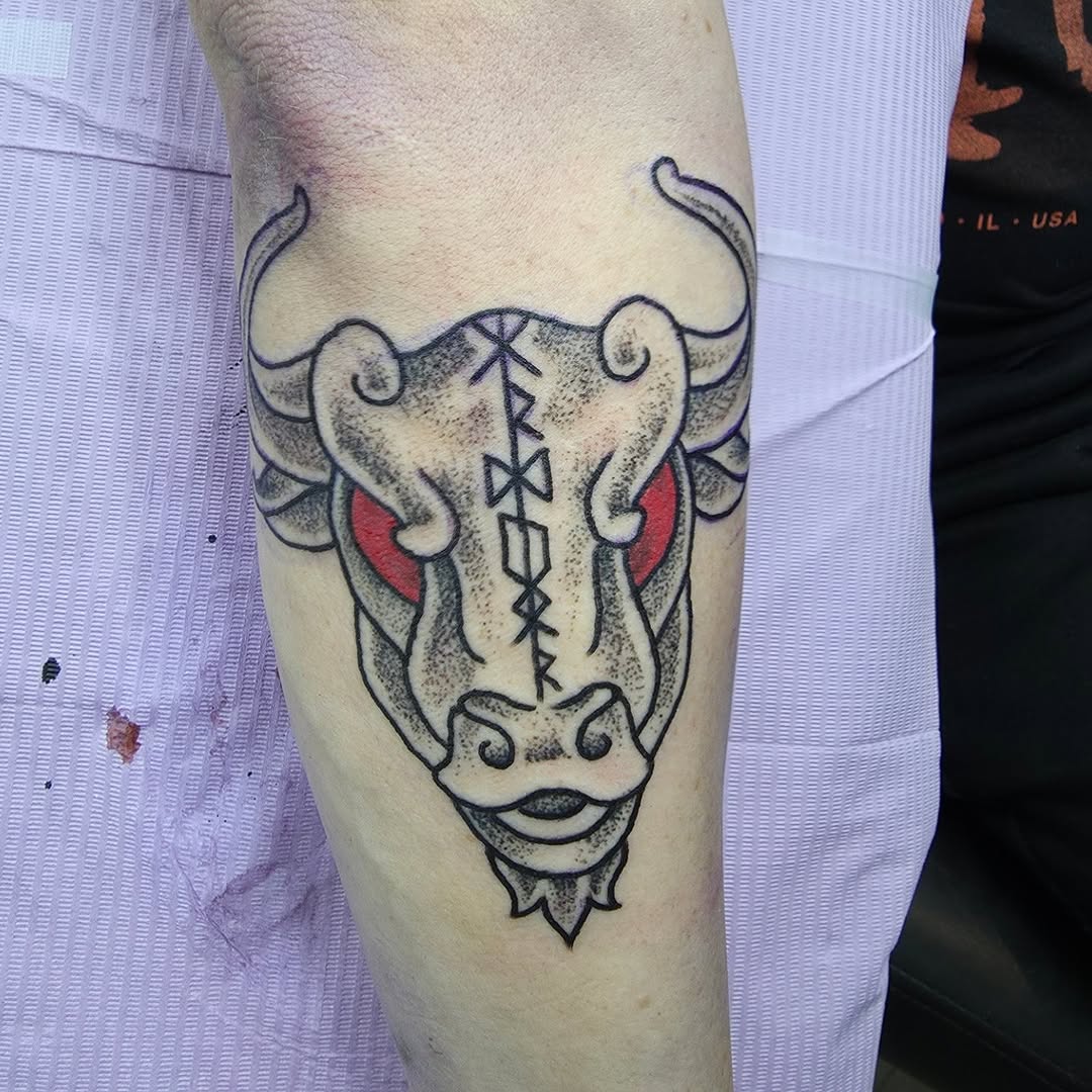 Bold blackwork bull head with Nordic stitch detail