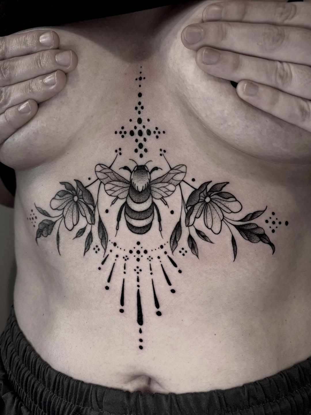 Symmetrical bee centerpiece with floral border, dotwork accents.