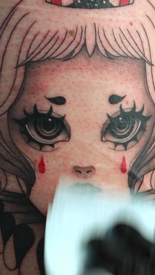 Manga-inspired girl portrait with bold black linework and red tears.