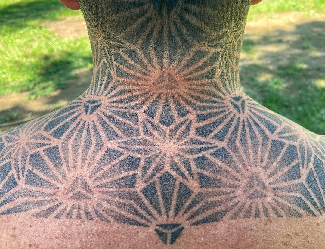 Intricate geometric starburst constellation with dotwork shading