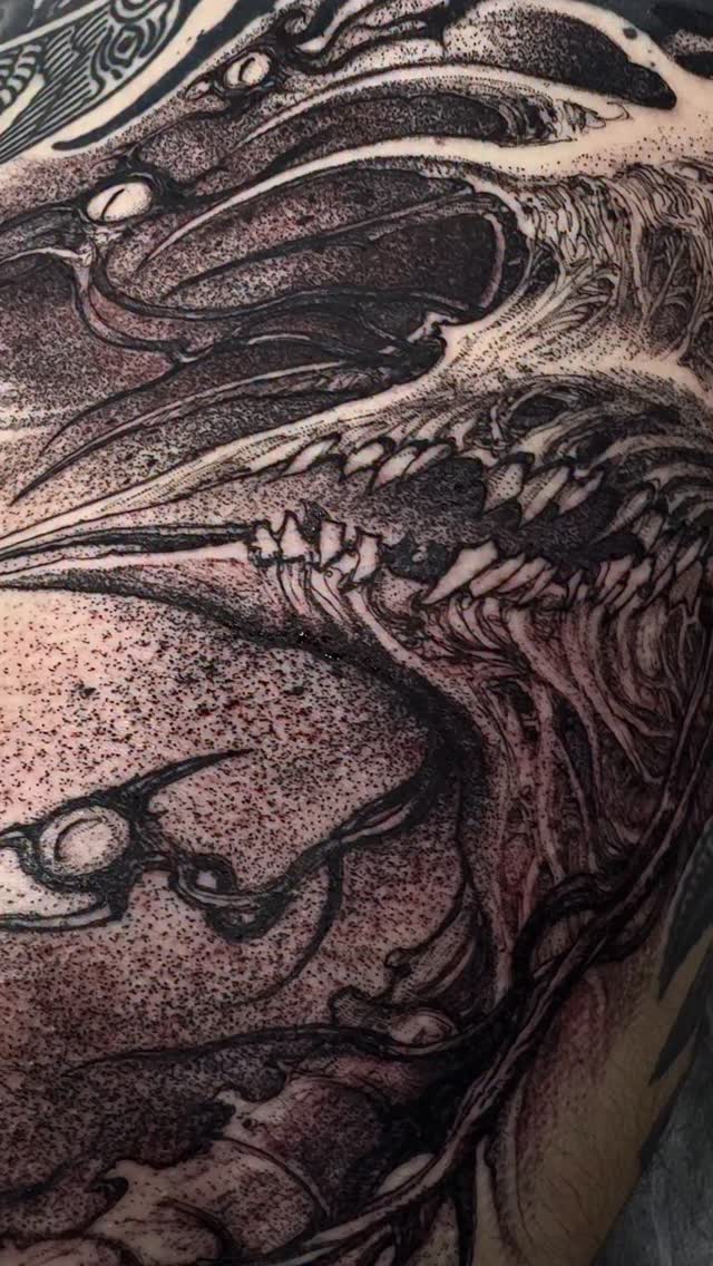 Monstrous dragon head in bold blackwork with dot shading