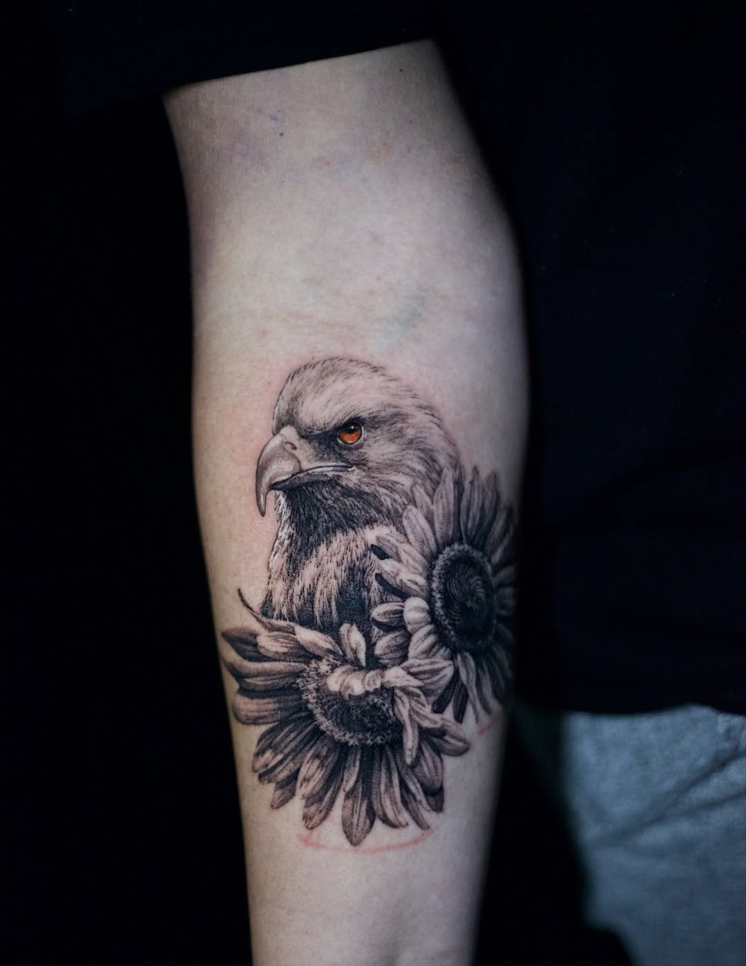 Hyper-detailed black-and-gray eagle head with sunflowers